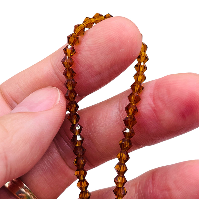 4mm Thunder Polish Glass Crystal Bicone Med. Smoked Topaz