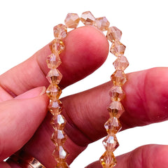 6mm Thunder Polish Glass Crystal Bicone Silver Champagne Shine